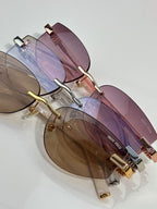 MiuMiu glasses close-up of rose lenses and gold temple hinge with branded detailing