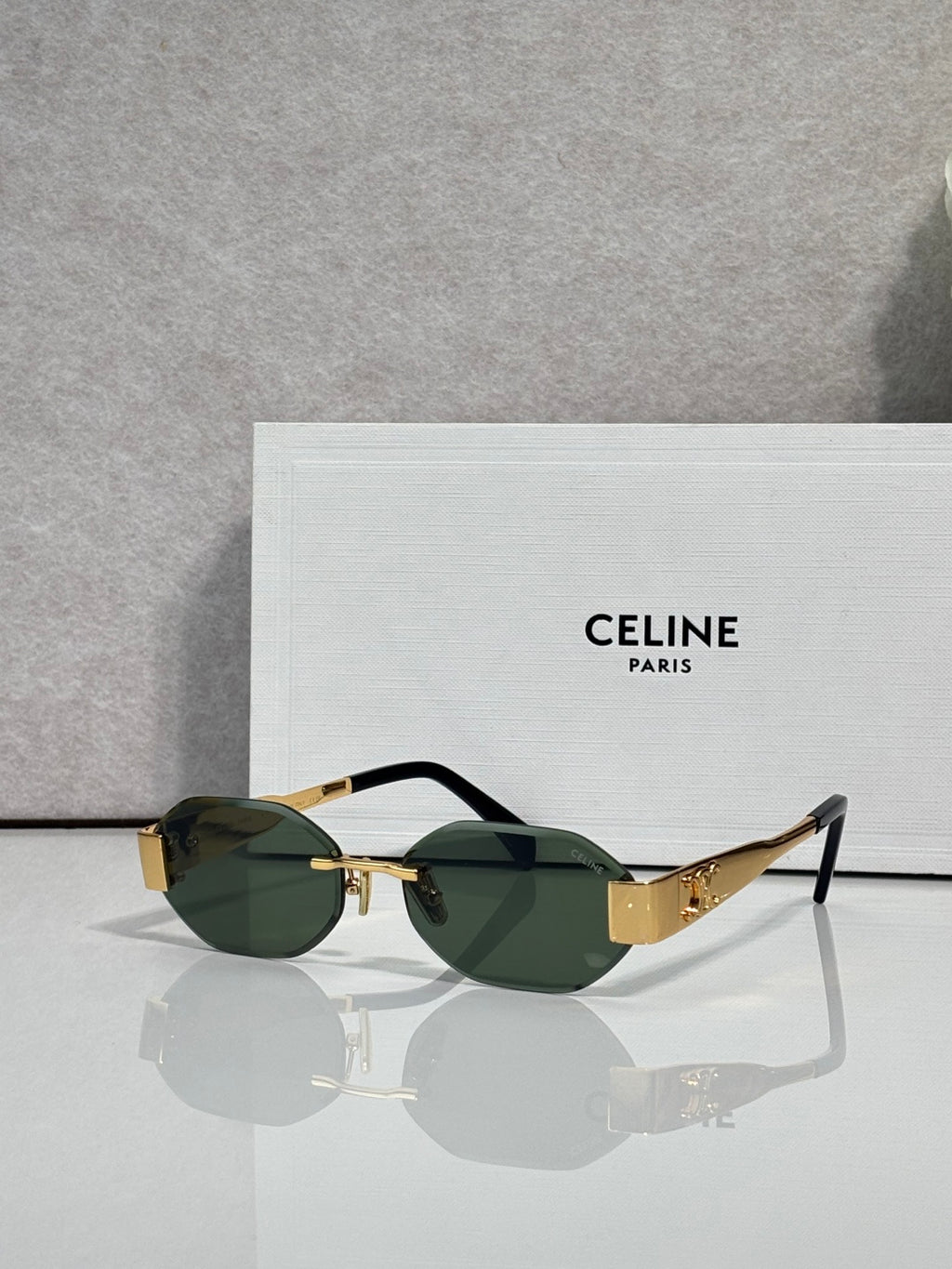 Celine oval sunglasses with gold-tone hinges and green-tinted lenses
