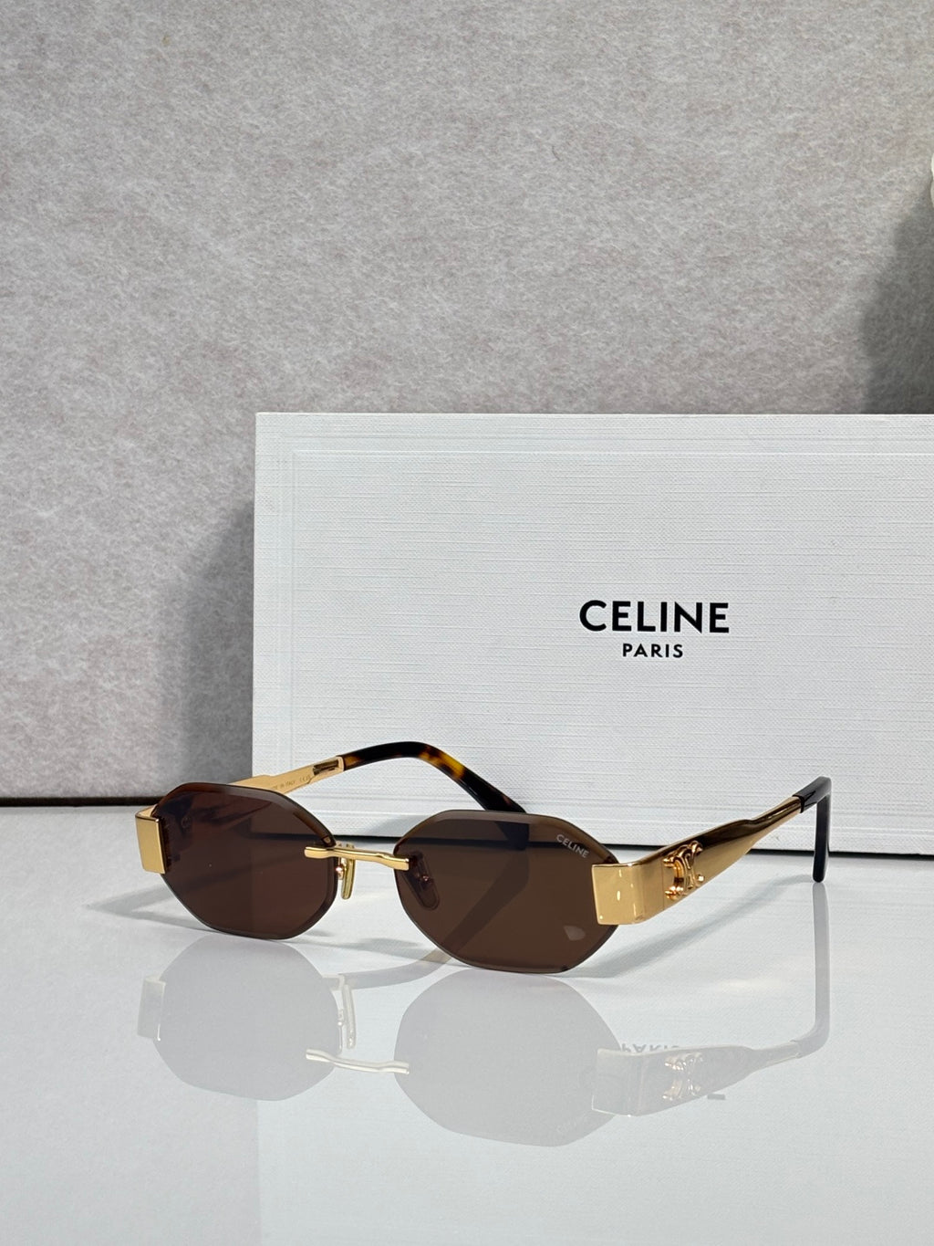 Celine oval sunglasses with tortoiseshell temples and brown-tinted lenses