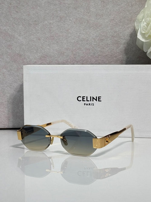 Celine oval sunglasses with gold-tone frame and dark gray lenses