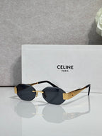 Celine oval sunglasses with black frame accents and dark gray lenses