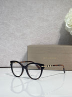 Bvlgari eyeglasses with dark blue round frame and gold temple accents