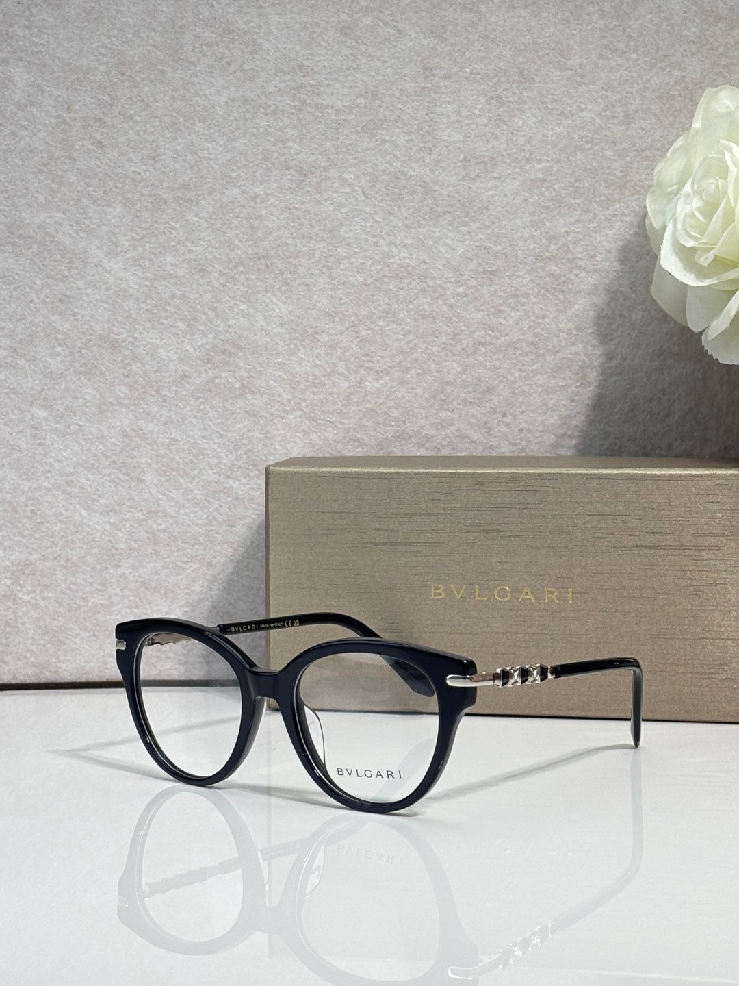 Bvlgari eyeglasses with black round frame and gold temple accents