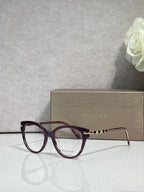 Bvlgari eyeglasses with burgundy round frame and gold temple detail