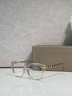 Bvlgari eyeglasses with light tortoise round frame and gold temple accents