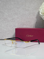 Cartier eyeglasses with dark frame and gold arms, clear lenses and logo