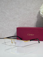 Cartier eyeglasses with dark frame and gold arms, clear lenses