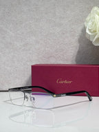 Cartier eyeglasses with dark frames, clear lenses, and gold temple accents