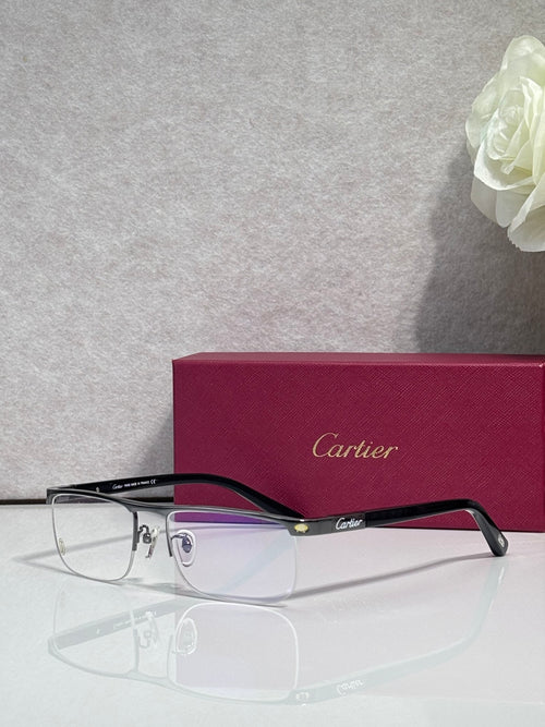 Cartier eyeglasses with dark frames, clear lenses, and gold temple accents
