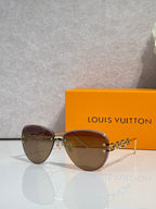 Louis Vuitton sunglasses with brown tinted lenses and gold chain temple detail
