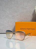 Louis Vuitton sunglasses with gold frame, tinted lenses, cat-eye silhouette