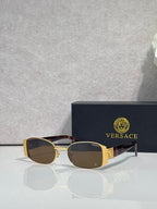 Versace glasses with gold frame, dark brown lenses, and tortoiseshell temples