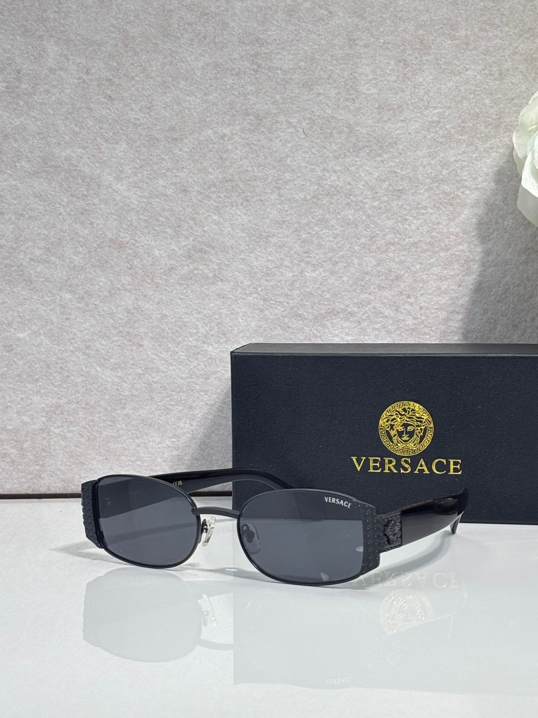 Versace glasses with black frame and dark tinted lenses, black temples