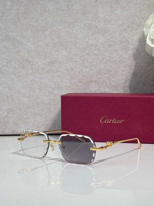 Cartier eyeglasses with gold-tone metal frame and rose-tinted lenses, side angle.