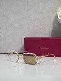 Cartier eyeglasses with gold-tone metal frame and pink-tinted lenses, front view.
