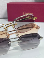 Cartier eyeglasses close-up: gold-tone frame hinges with dark lenses.