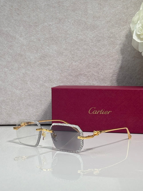 Gold-tone metal eyeglasses with smoky gray lenses and textured temple detailing.