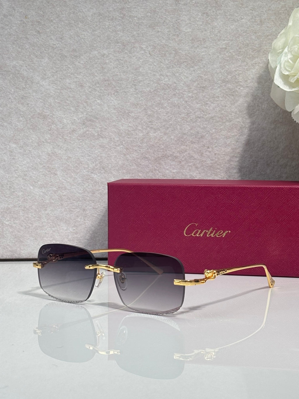 Cartier eyeglasses with dark-tone metal frame and tinted lenses, front view