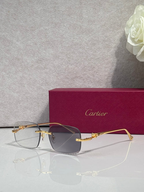 Cartier eyeglasses with gold-tone metal frame and tinted lenses, angled front view