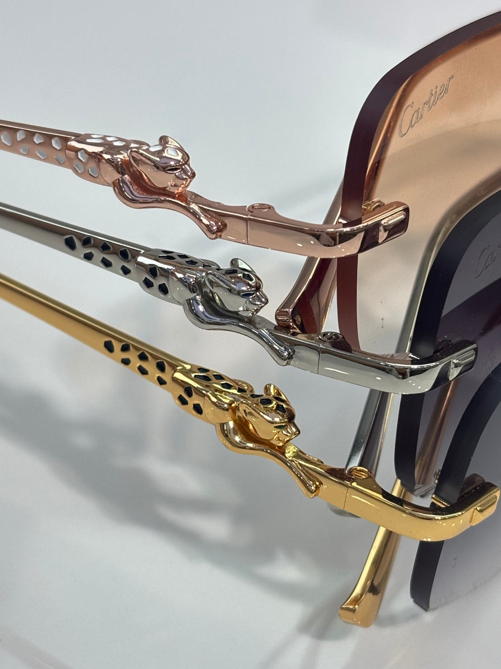 Close-up of Cartier eyeglass frame temple with gold-and-silver decorative links