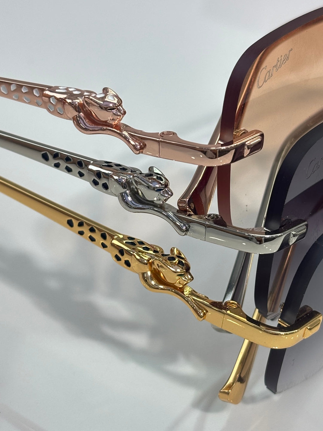 Close-up of Cartier eyeglass frame temple with gold-and-silver decorative links