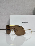 Celine sunglasses with brown-tinted lenses and gold-toned metal frame, oversized shield