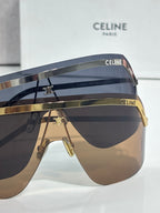 Celine sunglasses set with two shield pairs, navy and brown lenses, gold-toned accents