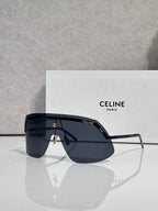 Celine sunglasses with deep navy lenses and slim silver metal frame, oversized shield