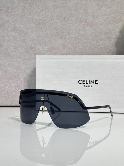 Celine sunglasses with deep navy lenses and slim silver metal frame, oversized shield