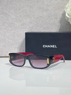 Chanel sunglasses with dark frames, pink and red-toned arms, rectangular lenses