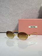 MiuMiu round sunglasses with olive lenses, gold-tone metal frame, logo details on temples
