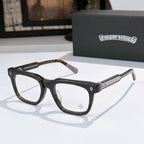 Dark tortoise and black rectangular eyeglass frames with gold temple accents and clear lenses