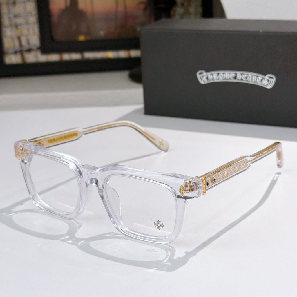 Clear eyeglass frames with gold patterned temple arms and clear lenses