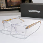 Clear eyeglass frames with gold patterned temple arms and clear lenses