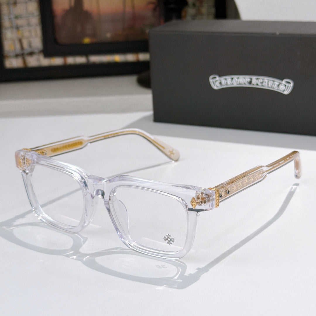 Clear eyeglass frames with gold patterned temple arms and clear lenses