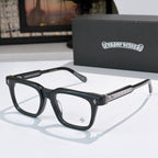 Black rectangular eyeglass frames with glittery silver-gold temple bars and clear lenses