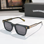 Chrome glasses with black frames, dark lenses, and gold temple detailing