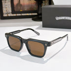 Chrome glasses with black frames, brown lenses, and patterned temple detailing