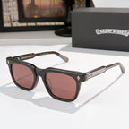 Chrome glasses with black frames and rose-brown lenses, with gold temple details