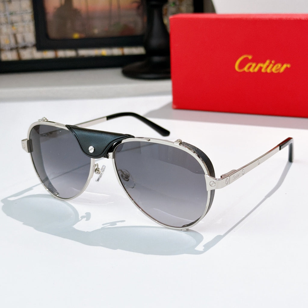 Cartier sunglasses with silver frame and gray tinted lenses, black temples