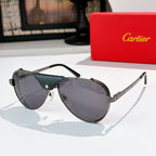 Cartier sunglasses with silver frame and dark gray tinted lenses, black temples