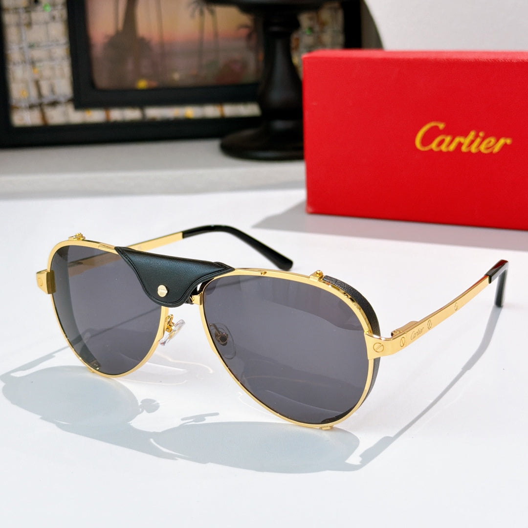 Cartier sunglasses with gold frame and dark gray tinted lenses, black temples