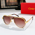 Cartier sunglasses with gold frame and warm brown tinted lenses, black temples