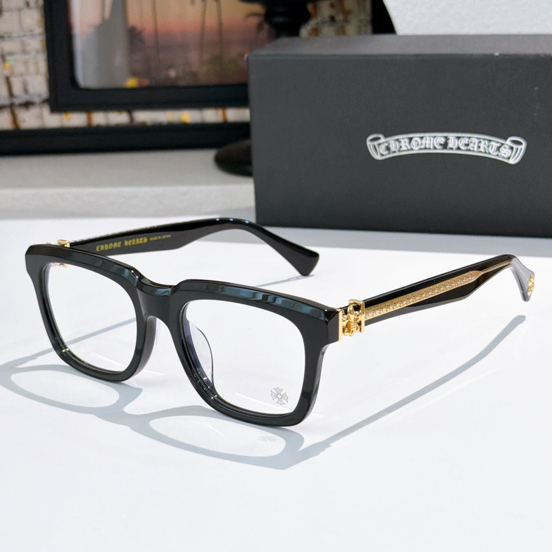 Black square eyeglasses with clear lenses and gold-tone temple accents