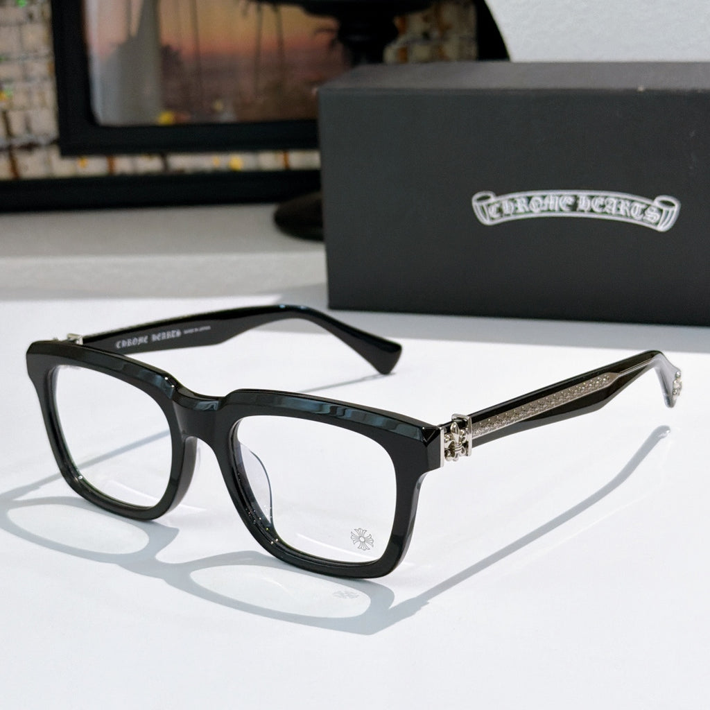 Black square eyeglasses with clear lenses and rhinestone-like temple detail