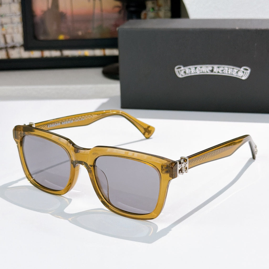 Gold-tone square cat-eye sunglasses with light pink lenses and jeweled bridge