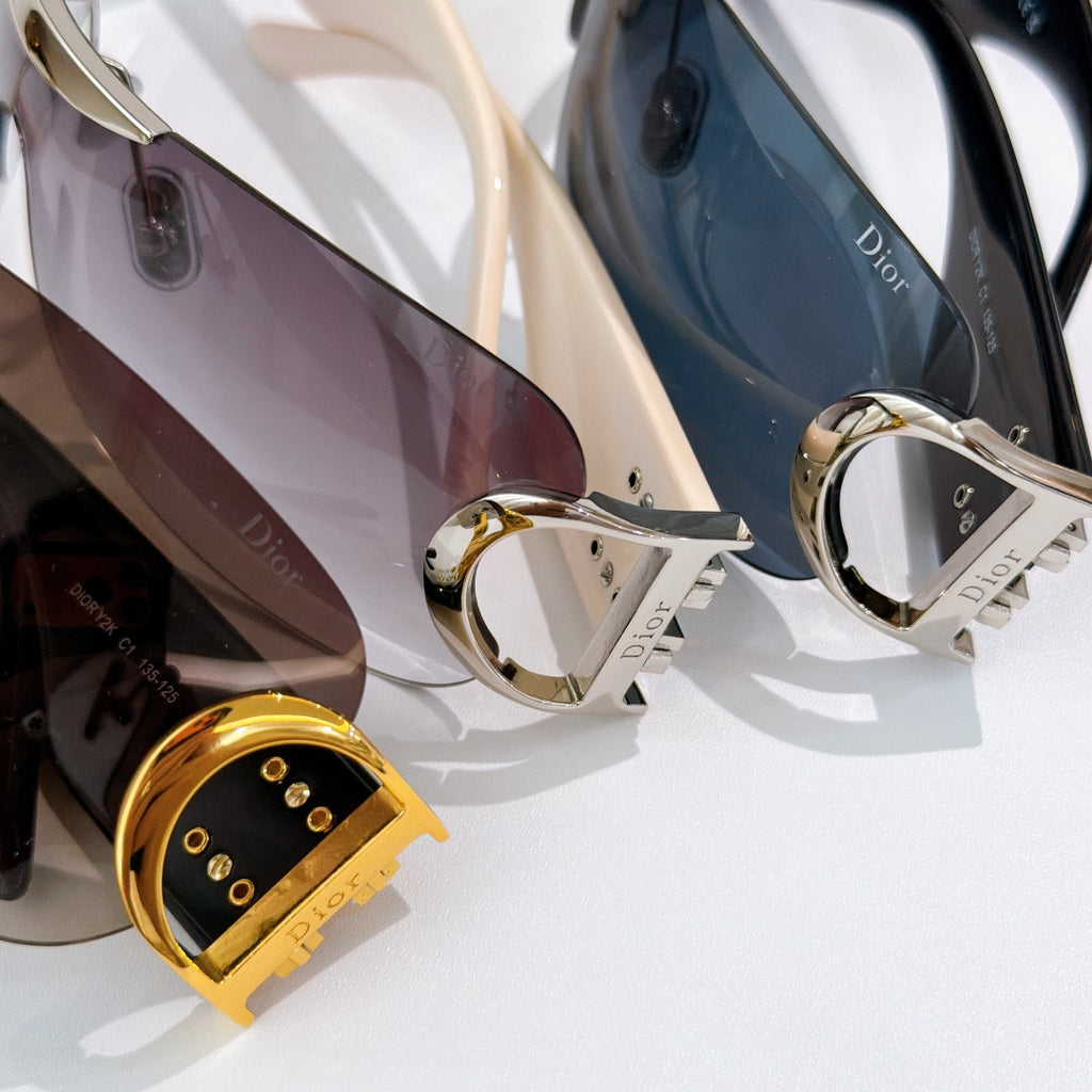 Dior sunglasses close-up with gold hardware and tinted lenses in multiple frames
