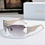 Dior sunglasses with cream frame, gold hinge, and light pink tinted lenses