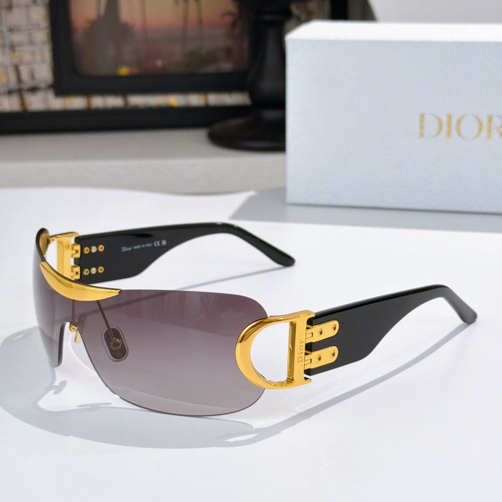 Dior sunglasses with black frame, gold temples, and dark tinted lenses