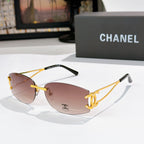 Gold-tone aviator sunglasses with pink-tinted lenses and Chanel logo on the lens
